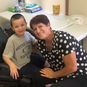 therapist and student smiling during therapy session