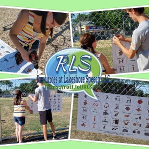 Woman and man installing playground communication sign