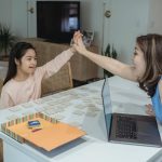 child giving high five to adult